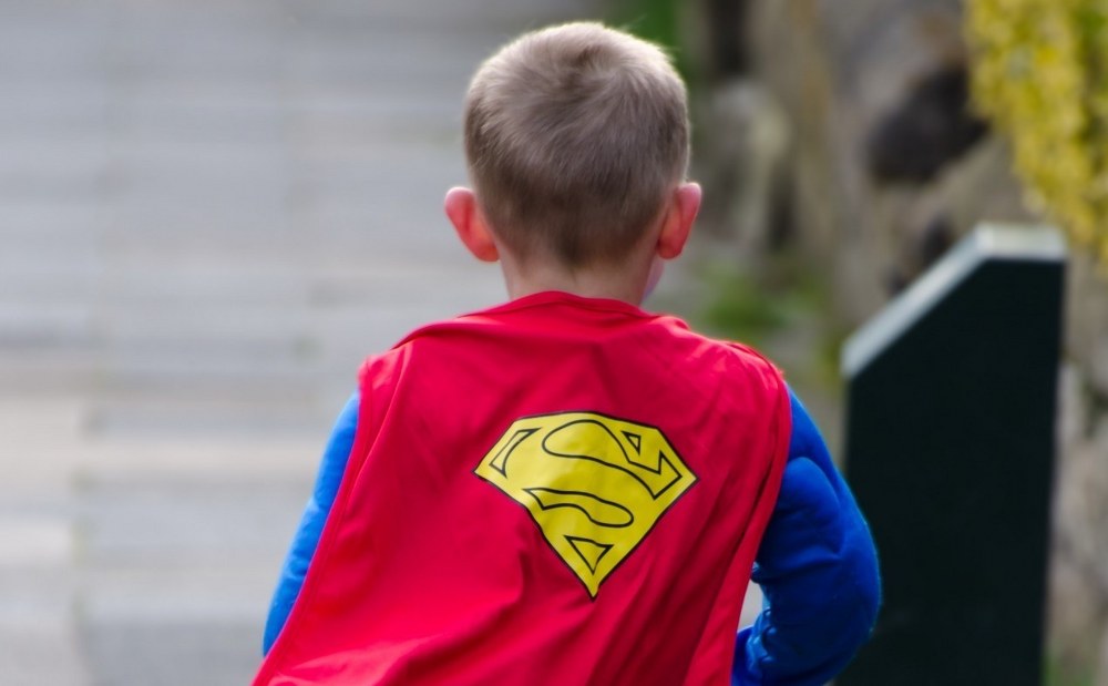 single dad - child in super hero outfit