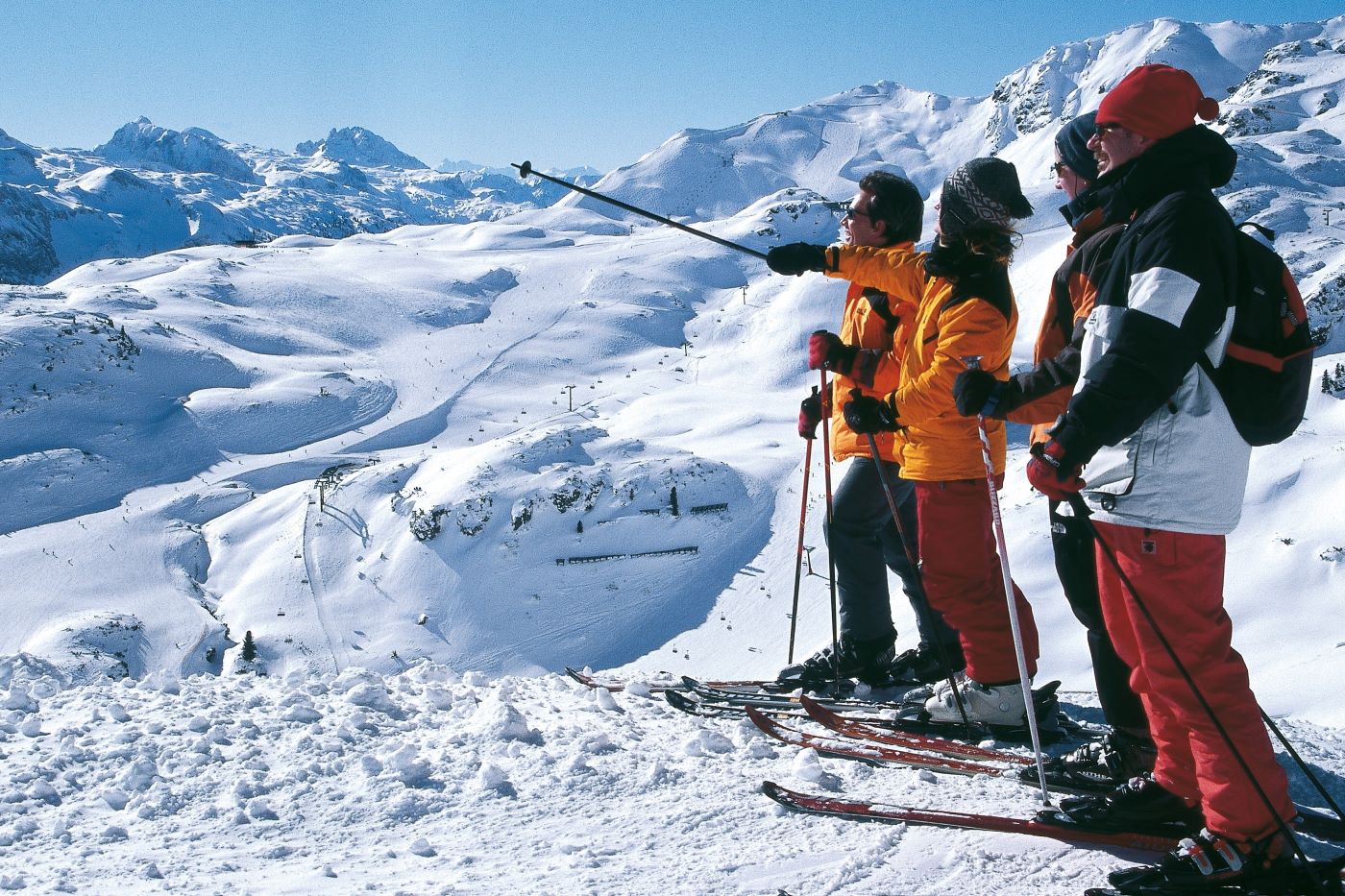 three skiers on solo ski holidays