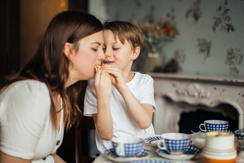 single mum and son in Paris creperie