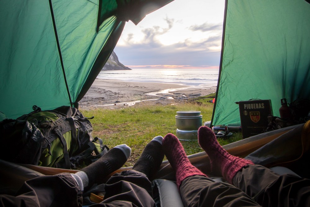 couple in warm socks in tent