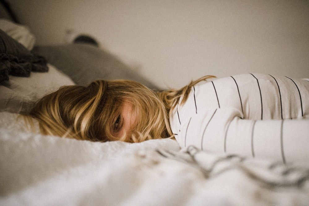 sleepy woman on bed