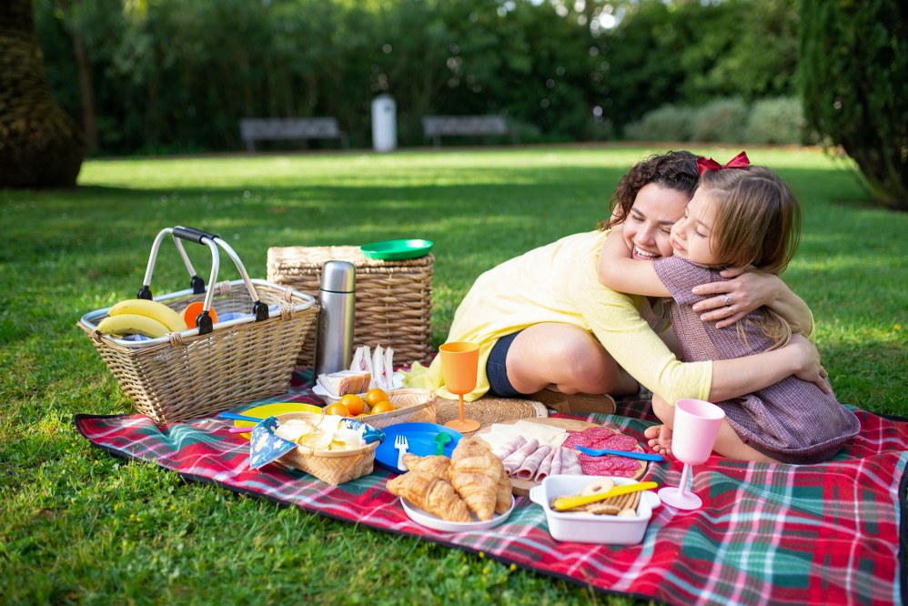 single mum and child on picnic on getaway 