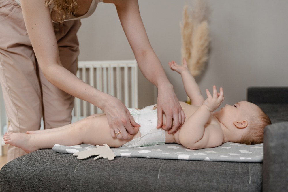 mum changing nappy